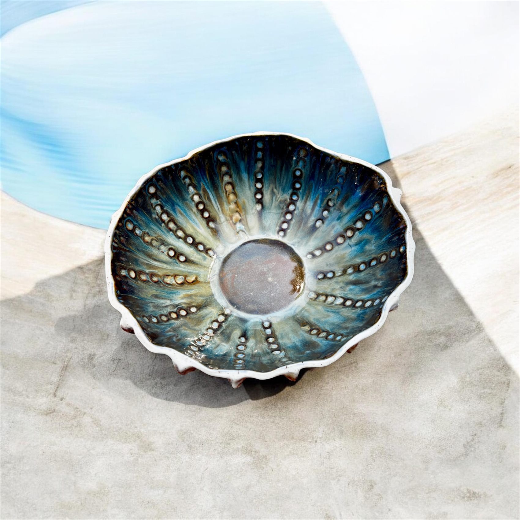 Blue Depths urchin bowl, glaze radiating from the centre
